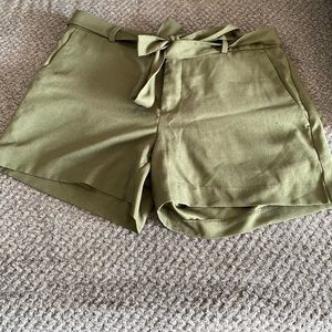 Green belted short shorts.
